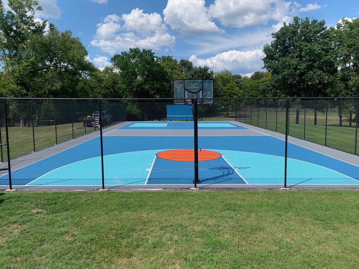 Finished two-tone blue court with orange center circle and new lines